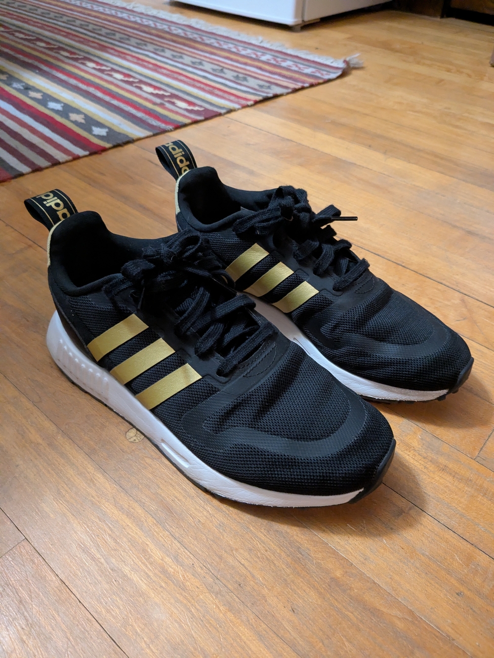 adidas Black Sneakers with Gold Stripes